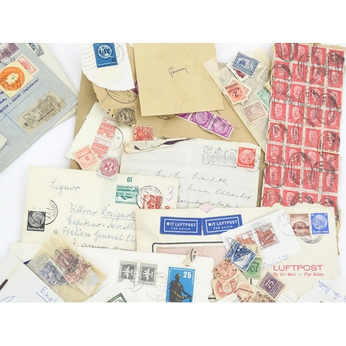 1195 - A large quantity of 19thC and later postage stamps and albums, to include two Penny Black stamps, on... 