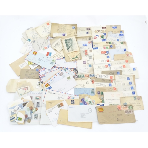 1195 - A large quantity of 19thC and later postage stamps and albums, to include two Penny Black stamps, on... 