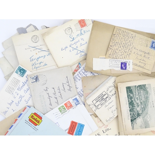 1195 - A large quantity of 19thC and later postage stamps and albums, to include two Penny Black stamps, on... 