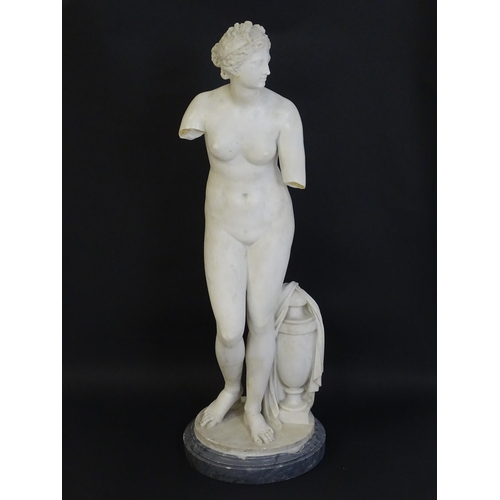 1196 - A composite marble sculpture depicting Aphrodite / Venus with a large urn. Approx. 30