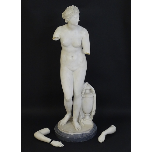 1196 - A composite marble sculpture depicting Aphrodite / Venus with a large urn. Approx. 30