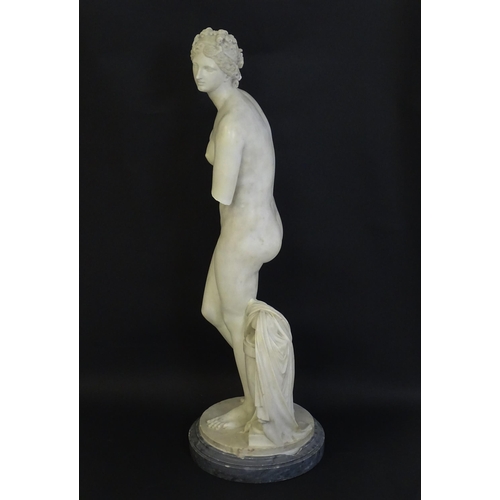 1196 - A composite marble sculpture depicting Aphrodite / Venus with a large urn. Approx. 30