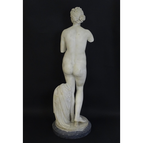 1196 - A composite marble sculpture depicting Aphrodite / Venus with a large urn. Approx. 30