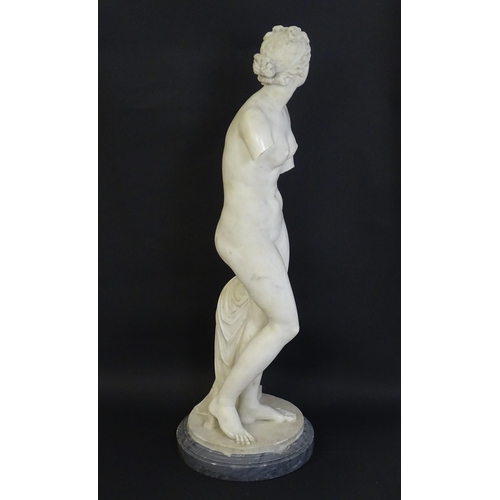 1196 - A composite marble sculpture depicting Aphrodite / Venus with a large urn. Approx. 30