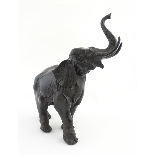 1199 - A 20thC Continental cast and patinated model of an elephant. Approx. 23 1/4