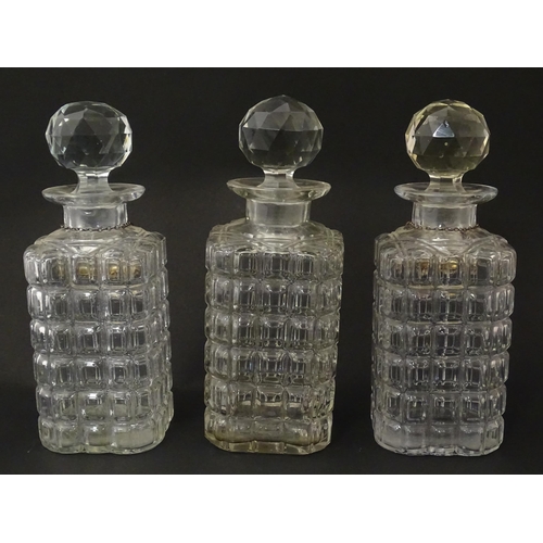 1204 - A late 19th / early 20thC oak tantalus with silver plate mounts, containing three glass decanters an... 