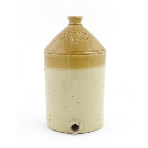 1205 - An early 20thC stoneware two tone flagon with spout lower, marked J. H. Clare Aylesbury 44. Approx. ... 