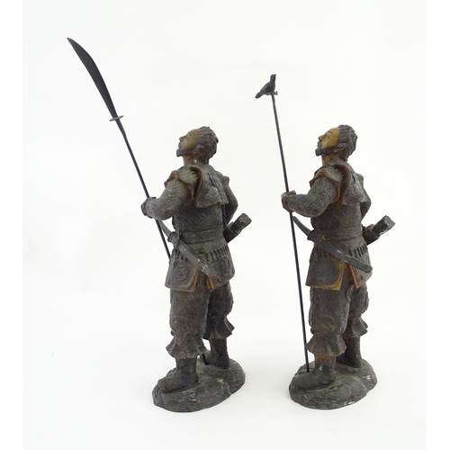 1225 - A pair of Japanese bronze sculptures depicting hunters / warriors, each with a quiver of arrows and ... 