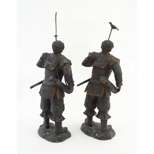 1225 - A pair of Japanese bronze sculptures depicting hunters / warriors, each with a quiver of arrows and ... 