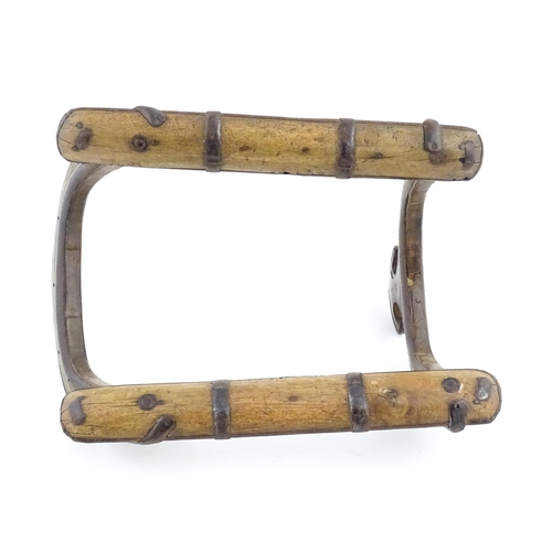 1226 - A hardwood camel saddle frame with brass mounts and punchwork detail. Approx. 17 3/4