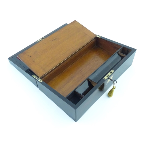 1228 - A late 19th / early 20thC coromandel writing slope with fitted interior. Approx. 5 1/4