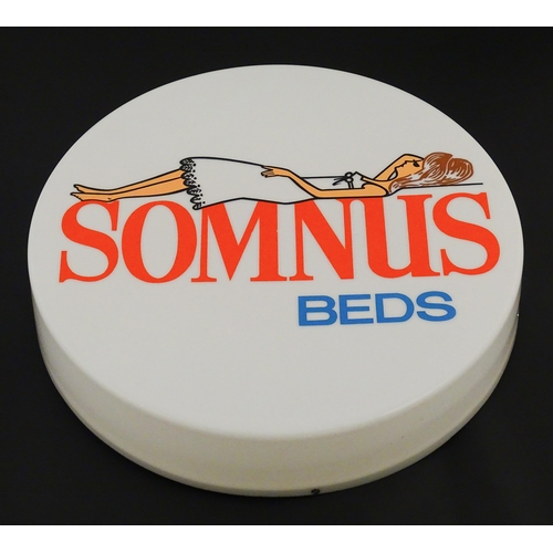 1232 - A 20thC advertising sign of circular form for Somnus Beds. Approx. 18 1/2