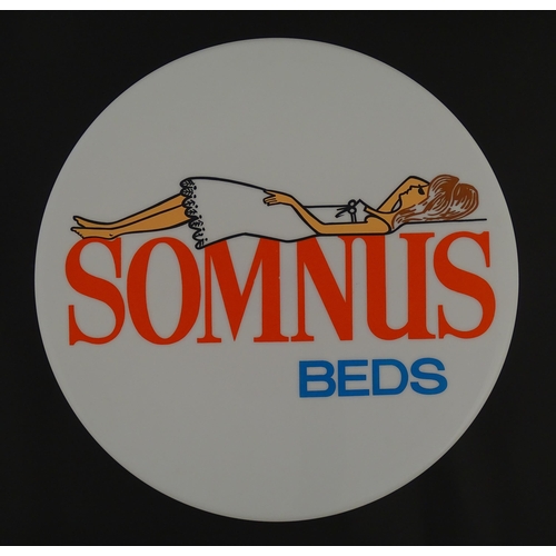 1232 - A 20thC advertising sign of circular form for Somnus Beds. Approx. 18 1/2