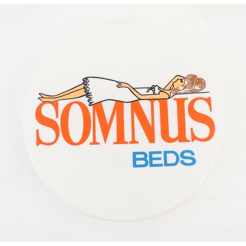 1232 - A 20thC advertising sign of circular form for Somnus Beds. Approx. 18 1/2