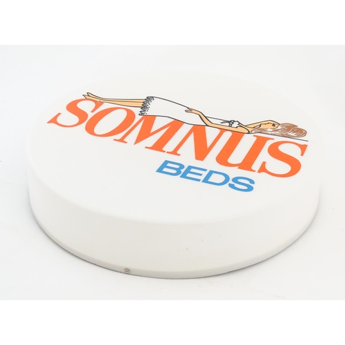 1232 - A 20thC advertising sign of circular form for Somnus Beds. Approx. 18 1/2