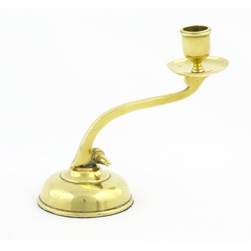 1238 - A 20thC brass piano candlestick in the manner of WAS Benson. Approx. 6