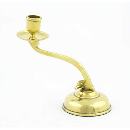 1238 - A 20thC brass piano candlestick in the manner of WAS Benson. Approx. 6