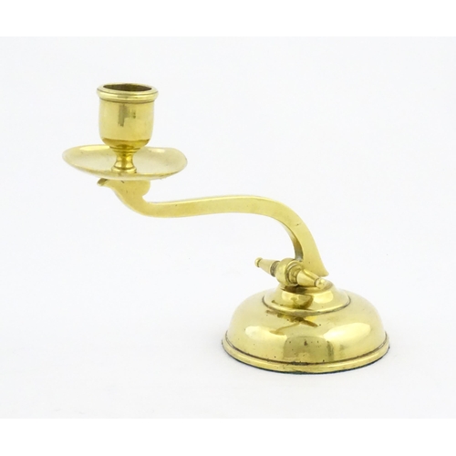 1238 - A 20thC brass piano candlestick in the manner of WAS Benson. Approx. 6