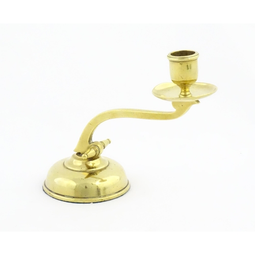 1238 - A 20thC brass piano candlestick in the manner of WAS Benson. Approx. 6