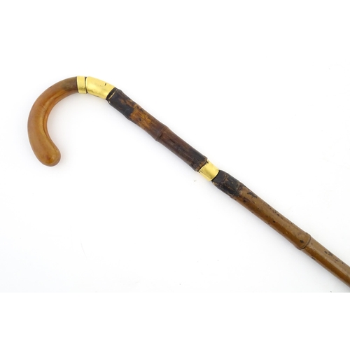 1248 - An early 20thC swordstick, the bamboo shank concealing a 24 3/8