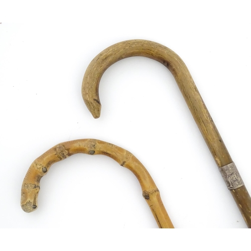 1251 - Four walking sticks, comprising a native tribal example with knop handle, an oriental stick with car... 