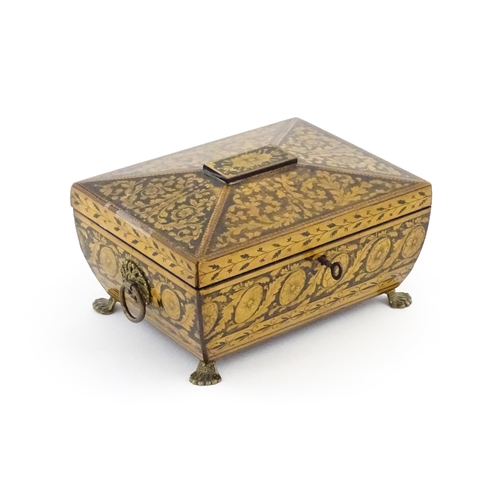 1172 - A 19thC penwork box of sarcophagus form with twin ring handles and stylised lion paw feet, decorated... 