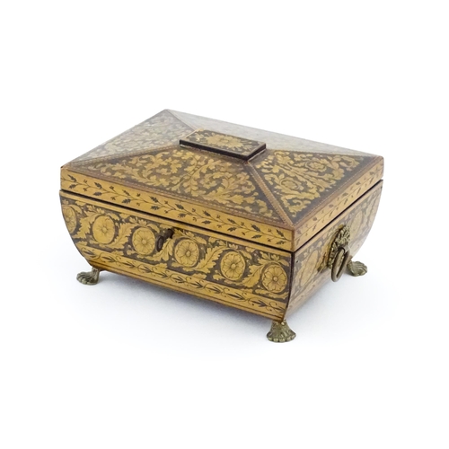 1172 - A 19thC penwork box of sarcophagus form with twin ring handles and stylised lion paw feet, decorated... 