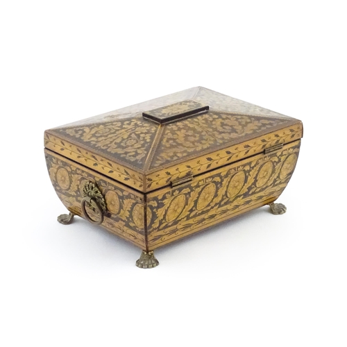 1172 - A 19thC penwork box of sarcophagus form with twin ring handles and stylised lion paw feet, decorated... 