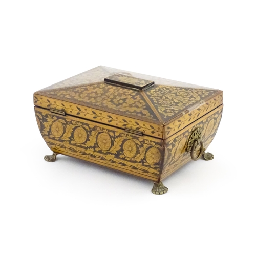 1172 - A 19thC penwork box of sarcophagus form with twin ring handles and stylised lion paw feet, decorated... 