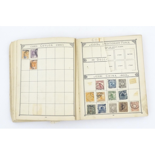 1194 - An early 20thC postage stamp album, containing numerous affixed worldwide stamps including 19thC and... 