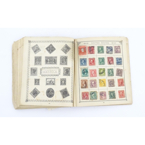 1194 - An early 20thC postage stamp album, containing numerous affixed worldwide stamps including 19thC and... 