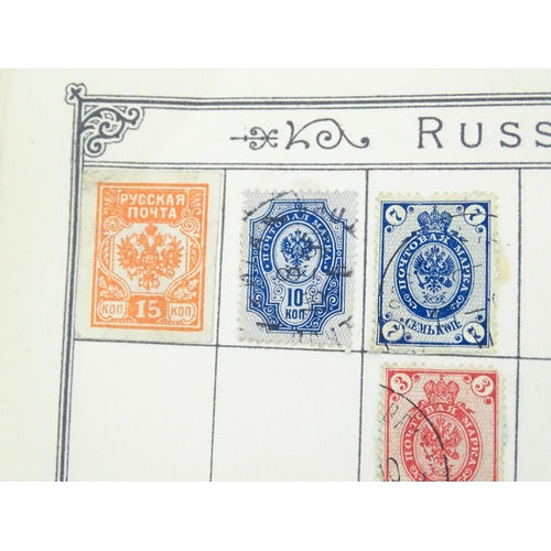 1194 - An early 20thC postage stamp album, containing numerous affixed worldwide stamps including 19thC and... 