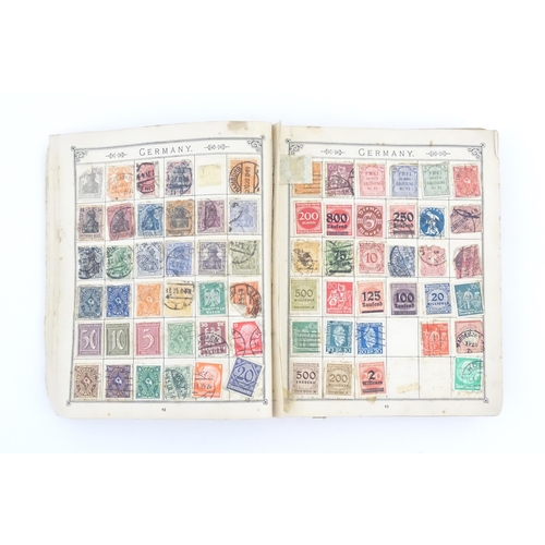 1194 - An early 20thC postage stamp album, containing numerous affixed worldwide stamps including 19thC and... 