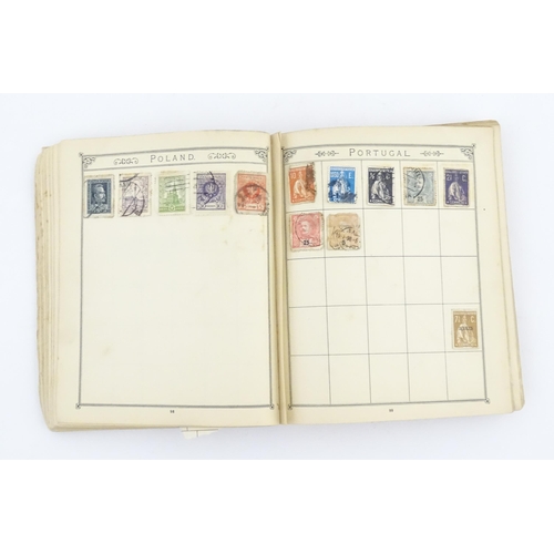 1194 - An early 20thC postage stamp album, containing numerous affixed worldwide stamps including 19thC and... 