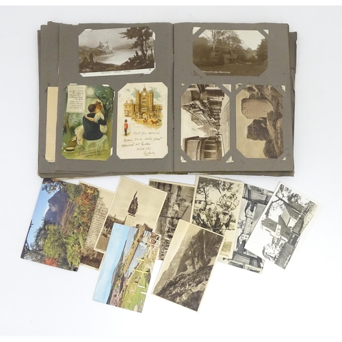 993 - A late 19thC - early 20thC postcard album containing pictorial and photographic postcards, subjects ... 