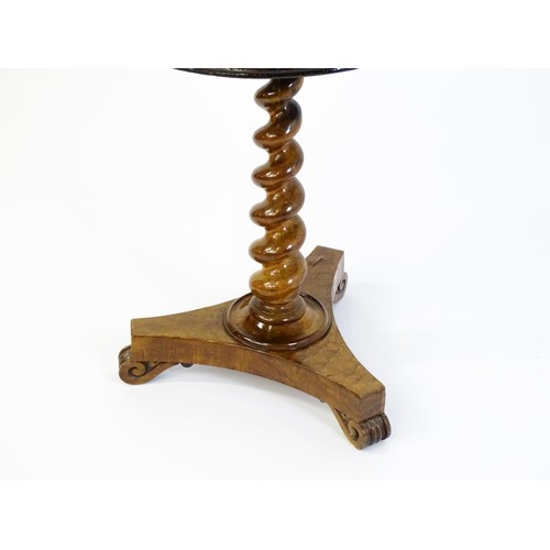 1396 - A 19thC tripod table with a circular top inlaid with a chessboard, floral decoration and a carved su... 