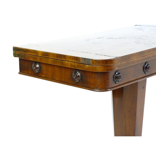 1331 - A 19thC mahogany card table with a rectangular top above applied, carved roundel decoration with a c... 