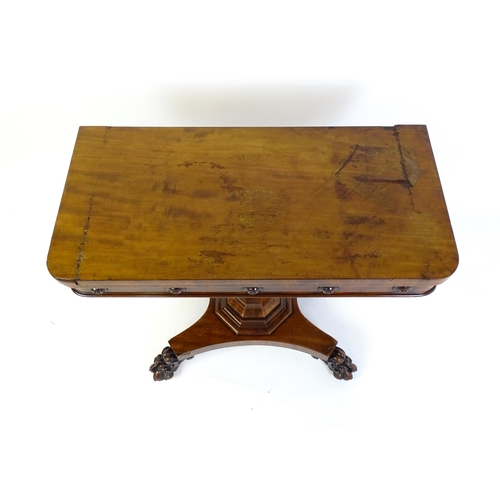 1331 - A 19thC mahogany card table with a rectangular top above applied, carved roundel decoration with a c... 