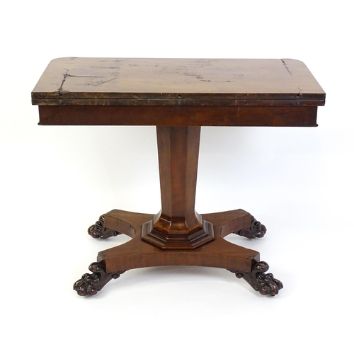 1331 - A 19thC mahogany card table with a rectangular top above applied, carved roundel decoration with a c... 