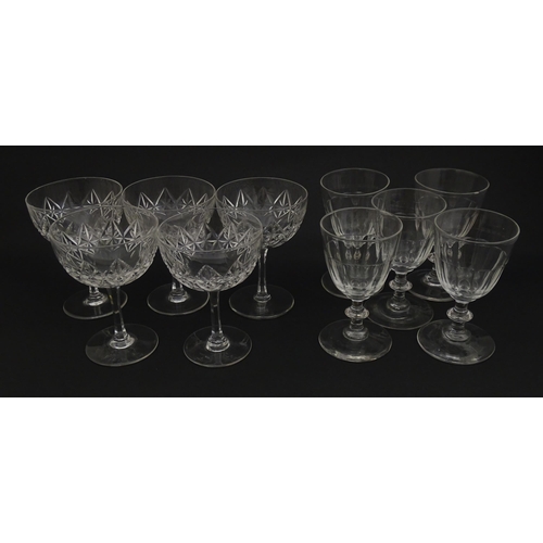 207 - Five cut glass champagne coupes together with five cut glass pedestal wine glasses. Approx 4 1/2