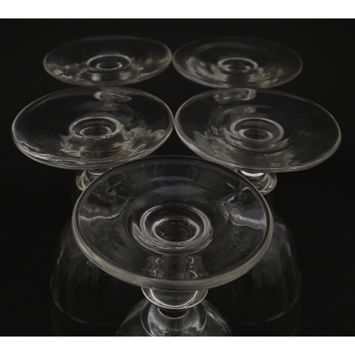 207 - Five cut glass champagne coupes together with five cut glass pedestal wine glasses. Approx 4 1/2