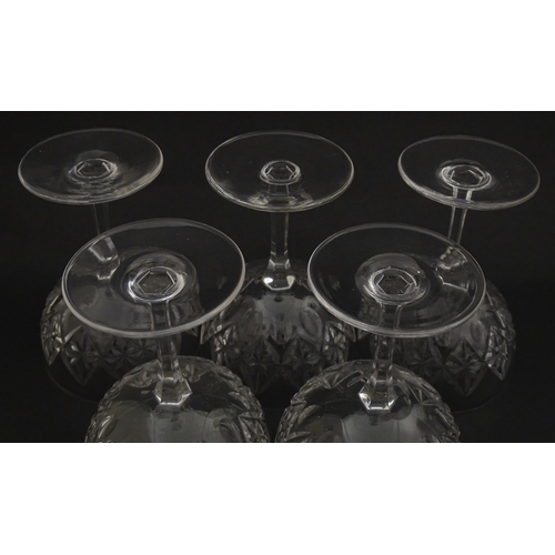 207 - Five cut glass champagne coupes together with five cut glass pedestal wine glasses. Approx 4 1/2