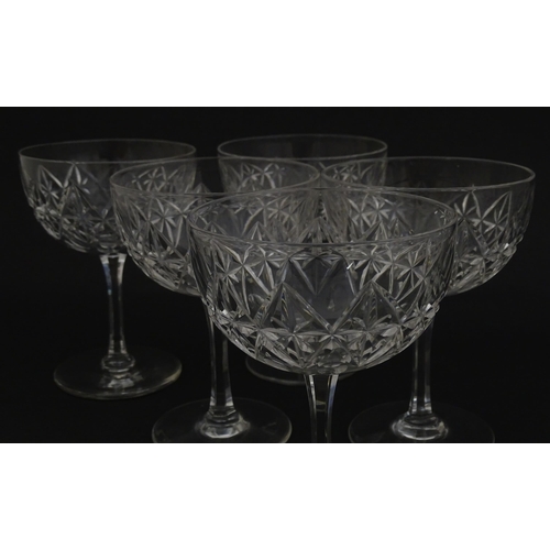 207 - Five cut glass champagne coupes together with five cut glass pedestal wine glasses. Approx 4 1/2