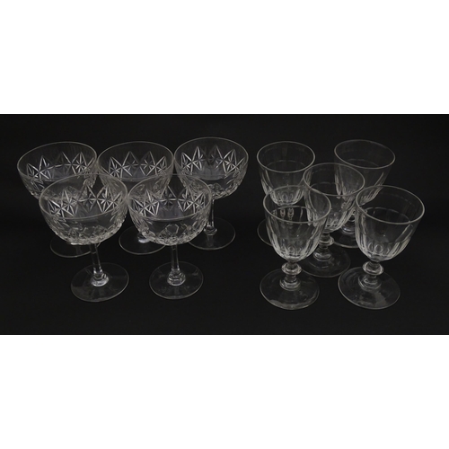 207 - Five cut glass champagne coupes together with five cut glass pedestal wine glasses. Approx 4 1/2