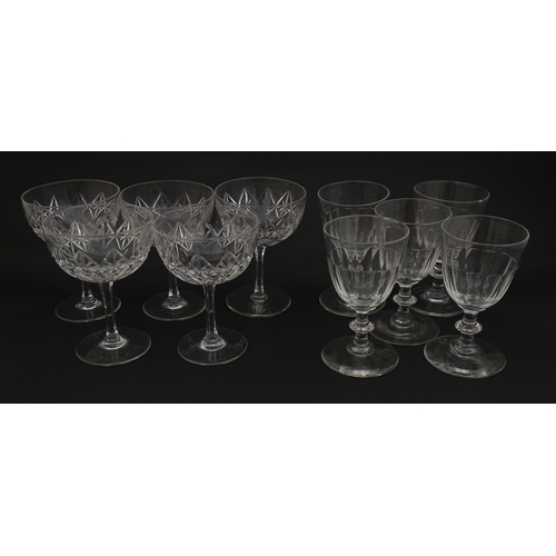 207 - Five cut glass champagne coupes together with five cut glass pedestal wine glasses. Approx 4 1/2