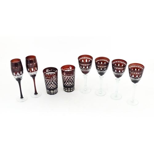 227 - A quantity of Bohemian style ruby red coloured drinking glasses comprising four pedestal wine glasse... 