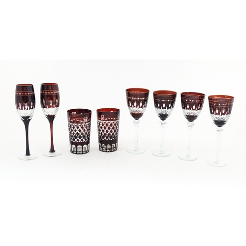 227 - A quantity of Bohemian style ruby red coloured drinking glasses comprising four pedestal wine glasse... 