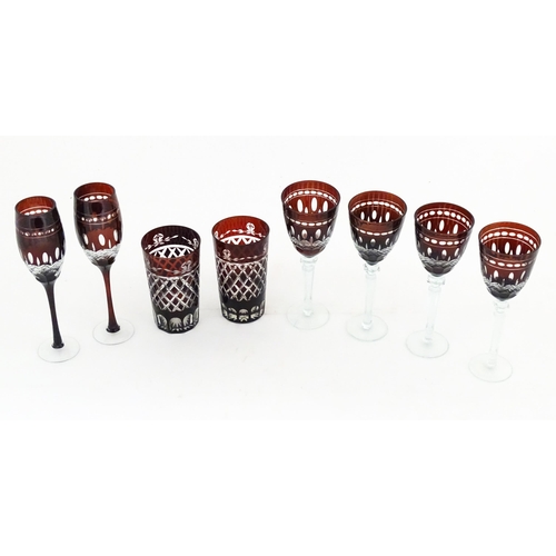 227 - A quantity of Bohemian style ruby red coloured drinking glasses comprising four pedestal wine glasse... 