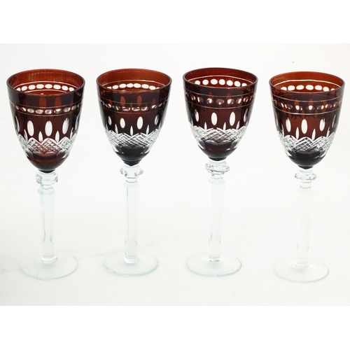 227 - A quantity of Bohemian style ruby red coloured drinking glasses comprising four pedestal wine glasse... 