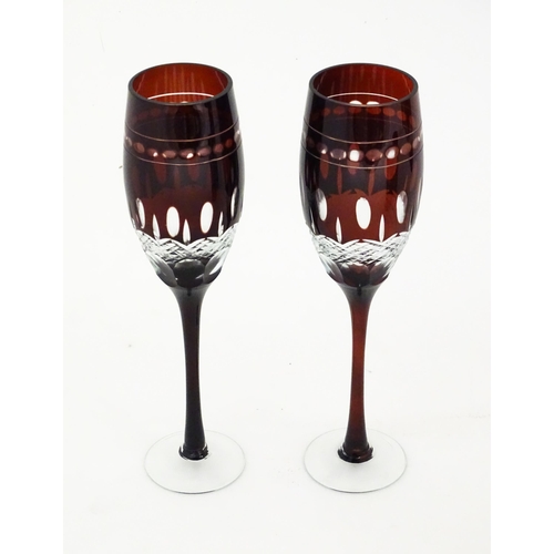 227 - A quantity of Bohemian style ruby red coloured drinking glasses comprising four pedestal wine glasse... 